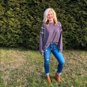 Boutique top with tassel sleeves